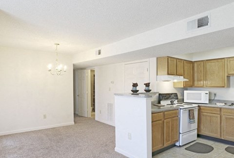 a kitchen with a stove microwave and a sink